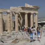 Tourists visit the Acropolis hill in Athens, Greece