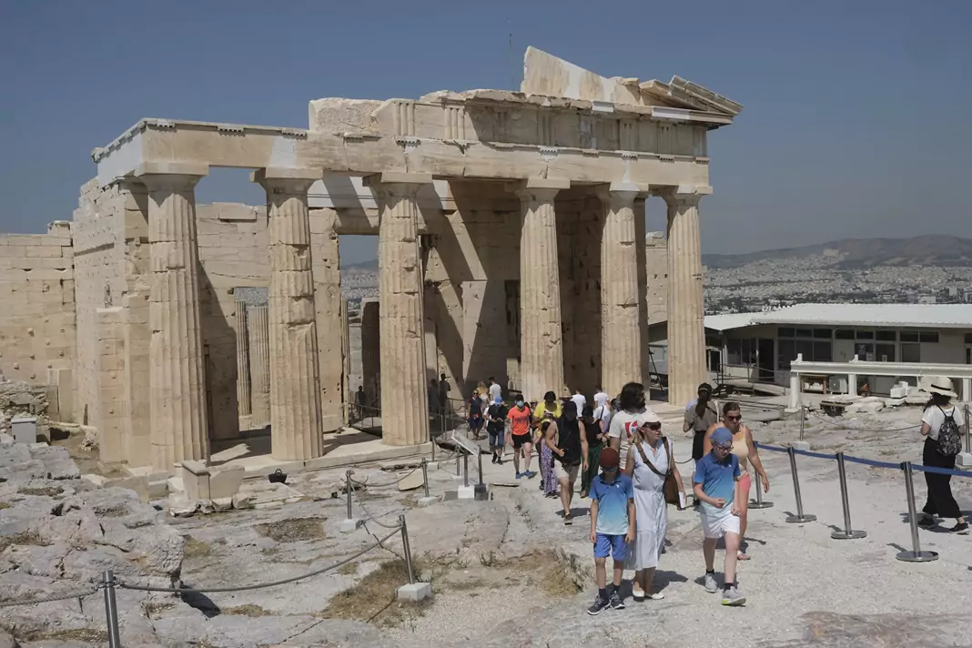 Tourists visit the Acropolis hill in Athens, Greece